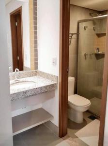 a bathroom with a sink and a toilet and a shower at MOVA Hotéis - Enjoy Olímpia Park Resort in Olímpia