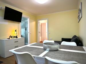 a dining room with a table with a bowl on it at One-Bedroom House close to the Beach in Armação de Pêra