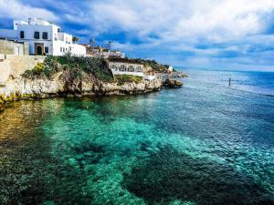 a view of the ocean near a beach with buildings at Dar El Amen Appartements in Mahdia