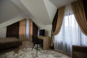 TV a/nebo společenská místnost v ubytování Premiera cottage