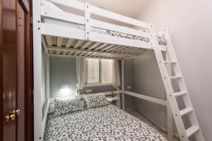 Posteľ alebo postele v izbe v ubytovaní Divi Apartments Valvanera