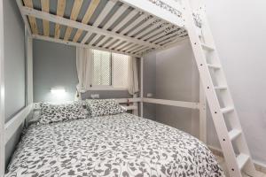 Posteľ alebo postele v izbe v ubytovaní Divi Apartments Valvanera