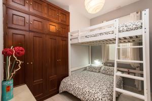 Posteľ alebo postele v izbe v ubytovaní Divi Apartments Valvanera