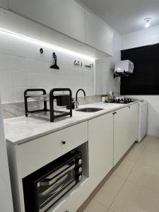 Una cocina o zona de cocina en 1-Apto 1 dorm Barra Sul com VAGA
