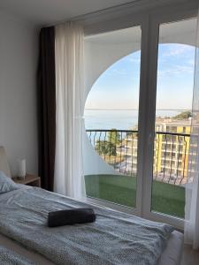 Posteľ alebo postele v izbe v ubytovaní Seaforth Apartment