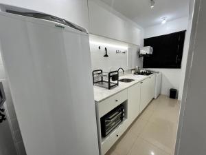 Una cocina o zona de cocina en 1-Apto 1 dorm Barra Sul com VAGA