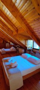 a large bedroom with three beds in a room at Johnny Jo Villa in Aígio +44 photos