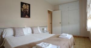 Postel nebo postele na pokoji v ubytování CASA PORTELA APARTAMENTOS