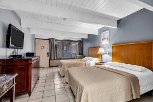 Postel nebo postele na pokoji v ubytování Aztec Ocean Resort