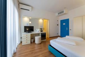 Voodi või voodid majutusasutuse Hi Hotels Riva del Garda toas