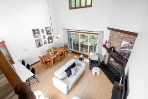 a living room with a couch and a fireplace at Les Manoirs 3bdrs Near Village in Mont-Tremblant