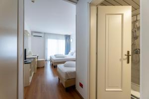 Voodi või voodid majutusasutuse Hi Hotels Riva del Garda toas