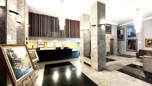 TV a/nebo společenská místnost v ubytování HOTEL DEL REY CURITIBA by POTY - NA FAMOSA RUA XV DE NOVEMBRO
