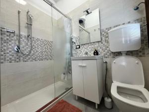 a bathroom with a white toilet and a shower at Premium Venice Residence in Mestre