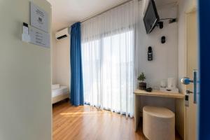 Voodi või voodid majutusasutuse Hi Hotels Riva del Garda toas