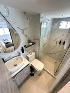 a bathroom with a shower and a toilet and a sink at Luxury apartment with sea view in Cartagena de Indias
