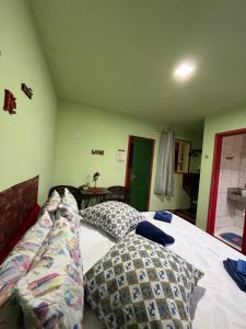 Postel nebo postele na pokoji v ubytování Pousada Morango das Palmas