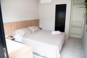 Postel nebo postele na pokoji v ubytování Iguassu Lofts