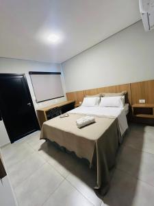 Postel nebo postele na pokoji v ubytování Iguassu Lofts