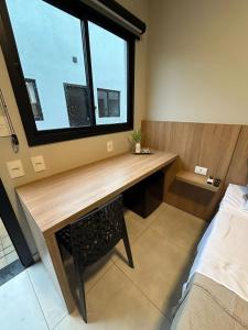 Postel nebo postele na pokoji v ubytování Iguassu Lofts