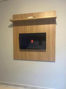 TV a/nebo společenská místnost v ubytování Iguassu Lofts