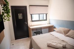 Postel nebo postele na pokoji v ubytování Iguassu Lofts