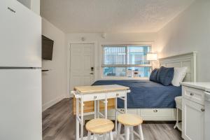 a small bedroom with a bed and a desk at Bright Gulf Coast Escape - 8 Mi to Johns Pass! in St Pete Beach +16 photos