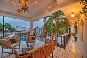 a balcony with chairs and a table on a building at Nueva Vista INN in Cruz de Huanacaxtle