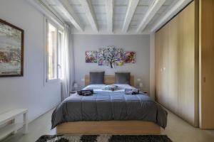 Postel nebo postele na pokoji v ubytování i-HOMES Luxury Suite Palazzo Arnaldi-Duomo