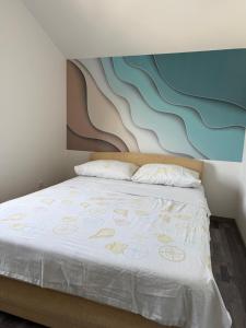 Ένα ή περισσότερα κρεβάτια σε δωμάτιο στο Apartman Zara