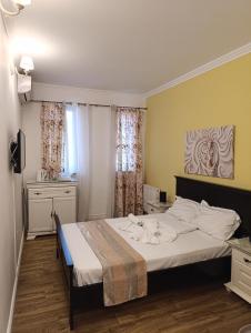 Postel nebo postele na pokoji v ubytování Adrys Boutique Villa