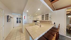 a kitchen with a sink and a counter top at Comfortable Condo - Gorgeous Slopeview and Access to 3 Hot Tubs Unit 303 at 1849 in Mammoth Lakes
