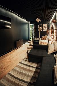 a living room with a couch and a bed at La casita by DADO in Vigo +48 photos