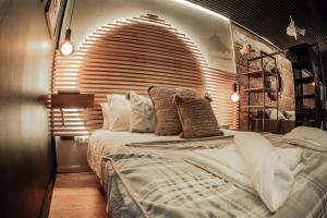 a bedroom with a large bed with a large window at La casita by DADO in Vigo