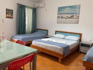 Postel nebo postele na pokoji v ubytování Garden Holiday Studios