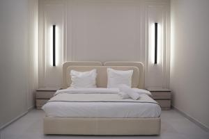Ένα ή περισσότερα κρεβάτια σε δωμάτιο στο Rateel Apartments 2