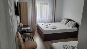 En eller flere senge i et værelse på Vila Dalex