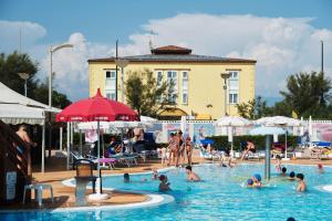 a group of people in a swimming pool at La Isla Resort in Pontecagnano