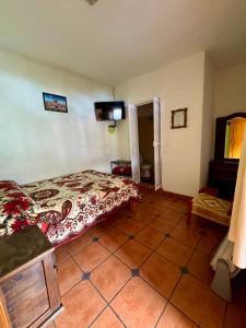 Postel nebo postele na pokoji v ubytování Hospedaje Teponaztle