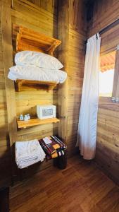 a room with two bunk beds and a window at Hotel isla bonita in Tintipan Island