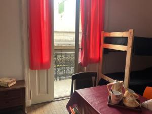 Ένα ή περισσότερα κρεβάτια σε δωμάτιο στο Hospedaje San Telmo CABA