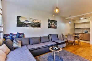 a living room with a couch and a table at Apartment Alex in Bar