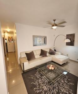a living room with a couch and a table at Luxury apartment in Santo Domingo Este in Juan López