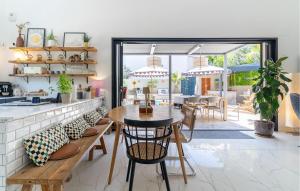 a kitchen and dining room with a table and chairs at Maison Piscine Proche Cassis in Gémenos