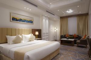 Postel nebo postele na pokoji v ubytování Nars Plus Al Naeem Hotel