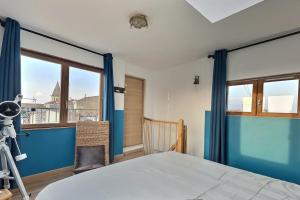 Ένα ή περισσότερα κρεβάτια σε δωμάτιο στο Charmant duplex Béziers les Halles