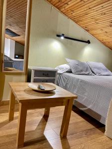 Postel nebo postele na pokoji v ubytování Casa Rural Jim Morrison
