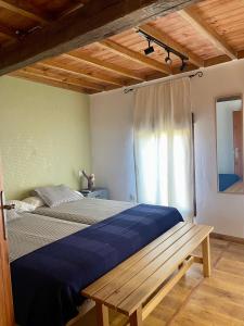 Postel nebo postele na pokoji v ubytování Casa Rural Jim Morrison