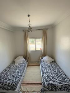 Postel nebo postele na pokoji v ubytování Ghazoua Gem