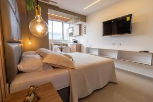 a bedroom with a bed in a room at Apartasuite Stay & Relax Itagui in Itagüí